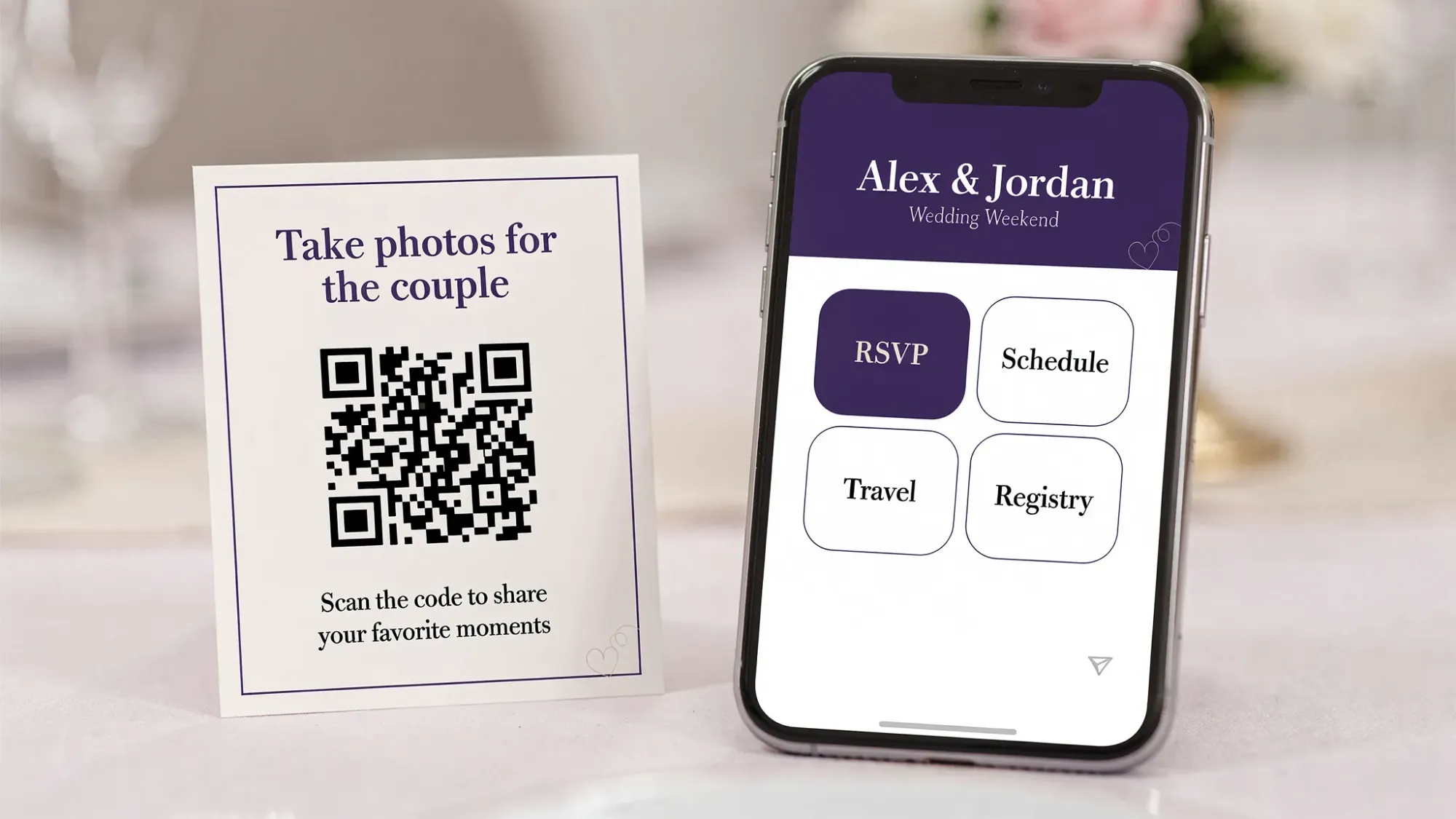 A mobile-friendly wedding website homepage shown on a phone screen with large buttons for RSVP, Schedule, Travel, and Registry. Next to the phone is a printed table card with a QR code labeled “Take photos for the couple” and a simple one-line instruction.