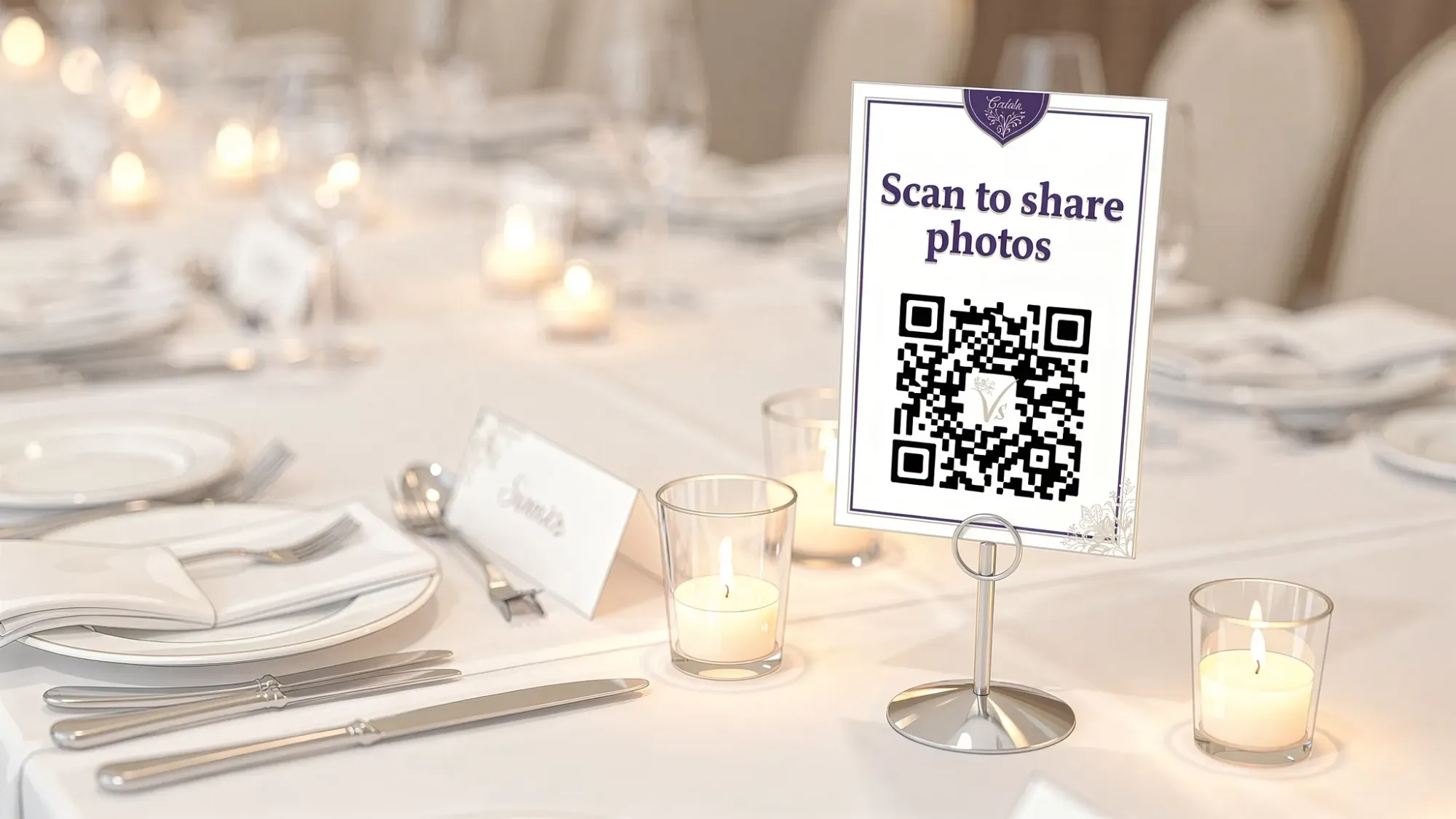 A wedding reception table setting with a small, tasteful QR sign that says “Scan to share photos,” placed near candles and place cards, designed to be visible and easy for guests to use.